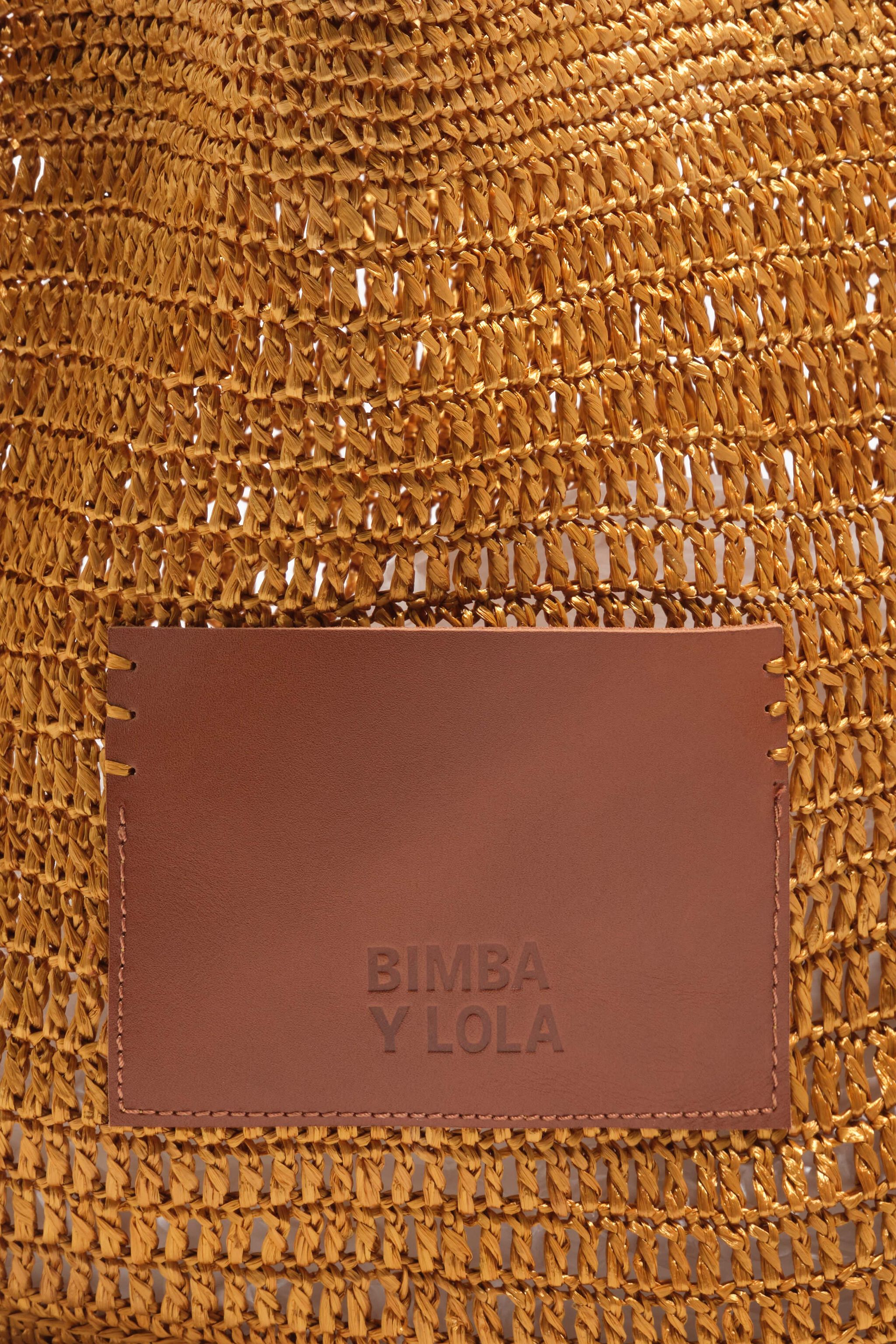 Große goldene geflochtene Tasche