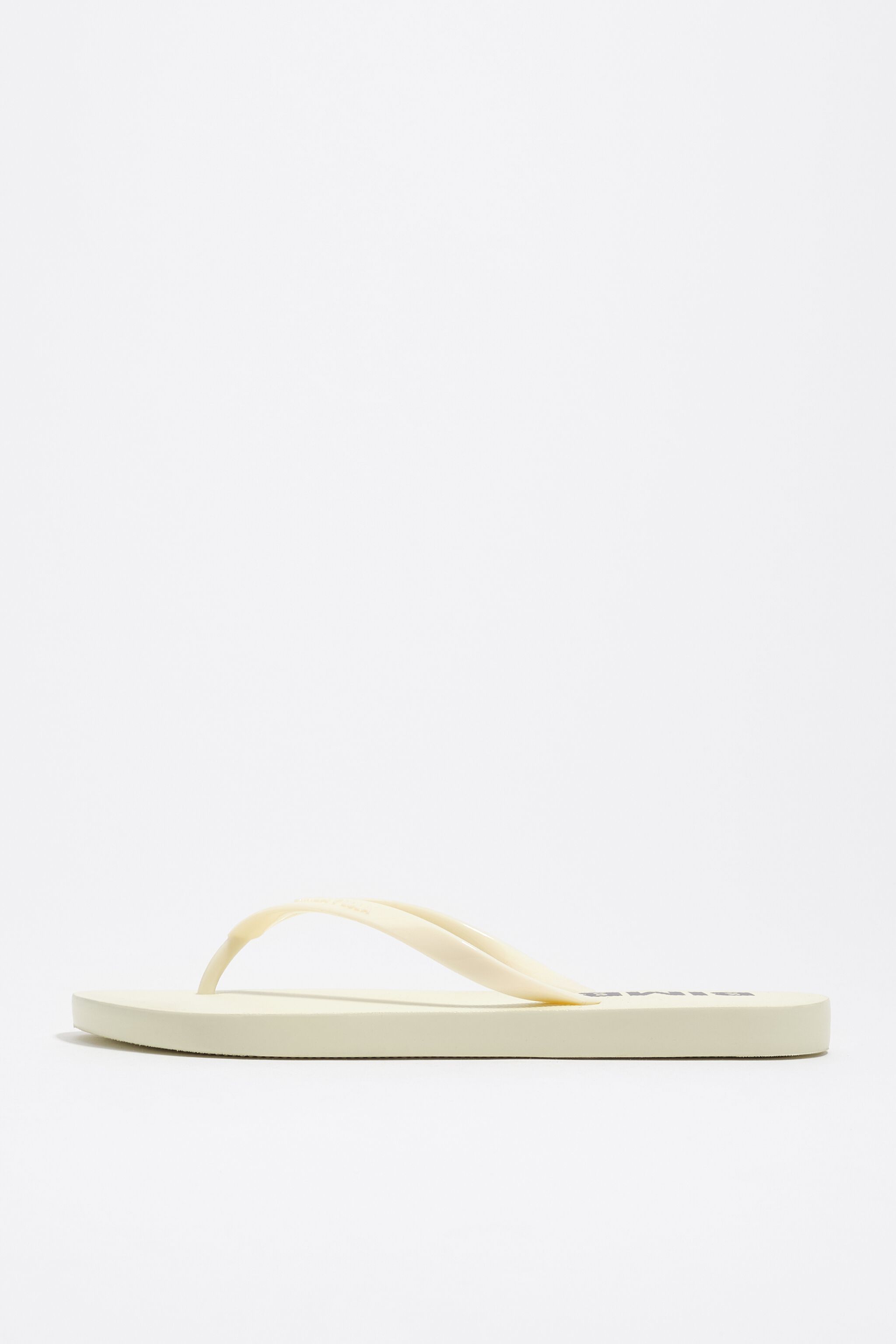 Elfenbeinfarbener Flip-Flop