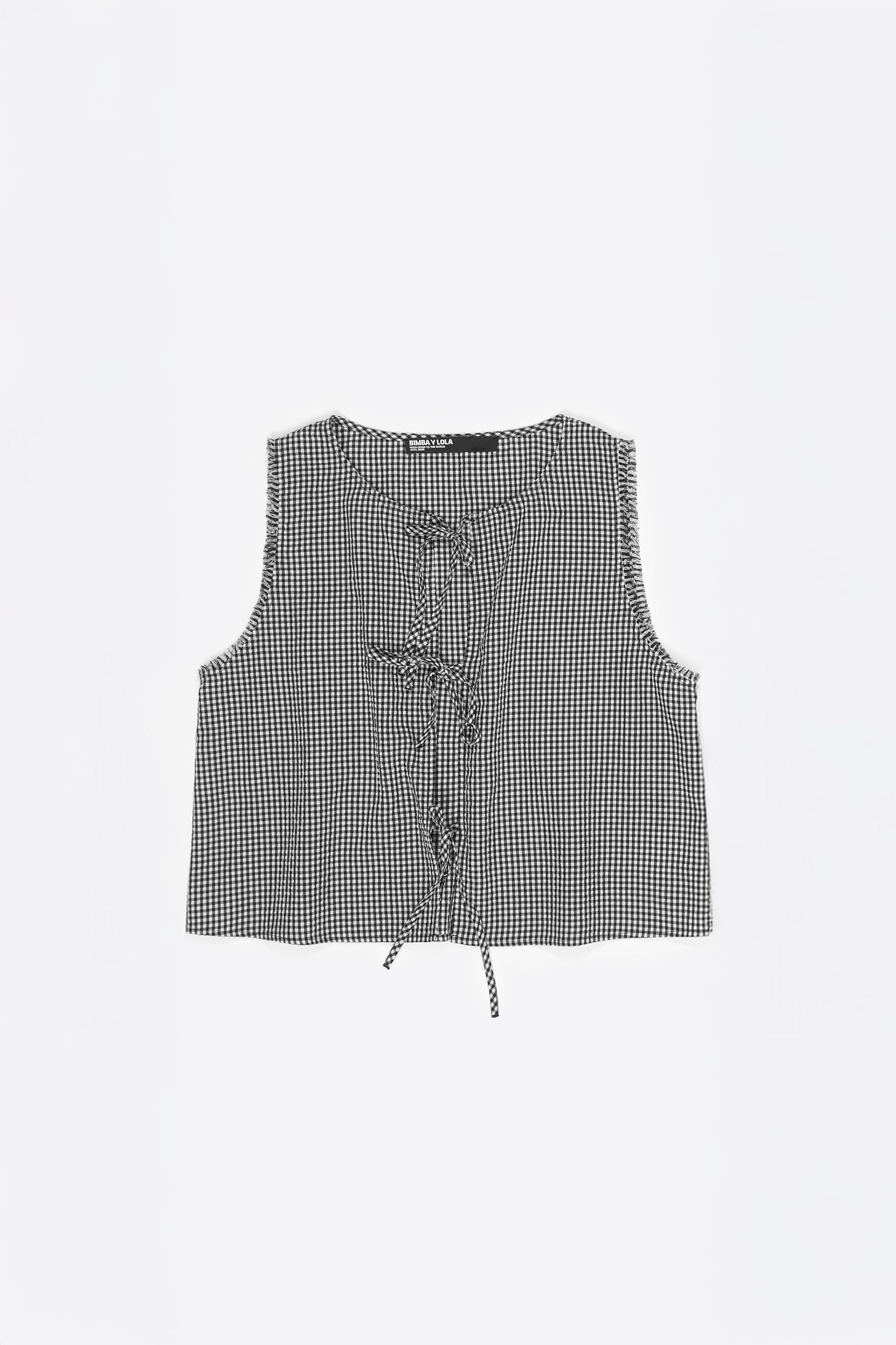 Schwarzes kariertes Top mit Bögen und abgenutzten Details