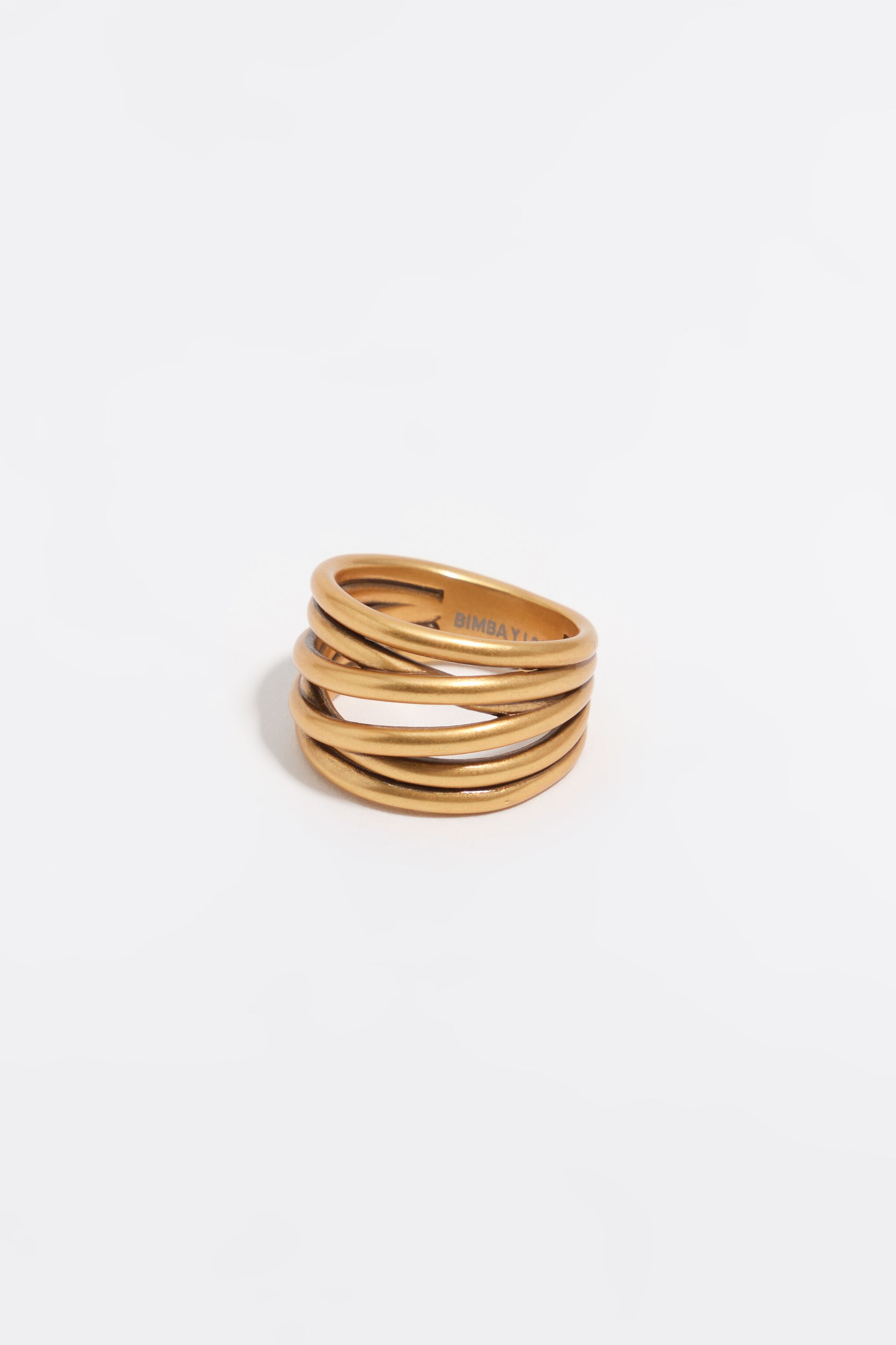 Matte-goldene Ring mit kreuzenden Bändern
